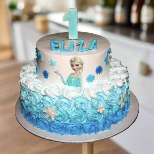 Blue Rose First Birthday Cake — white-and-blue finish, blue rose-style piping and number topper; India