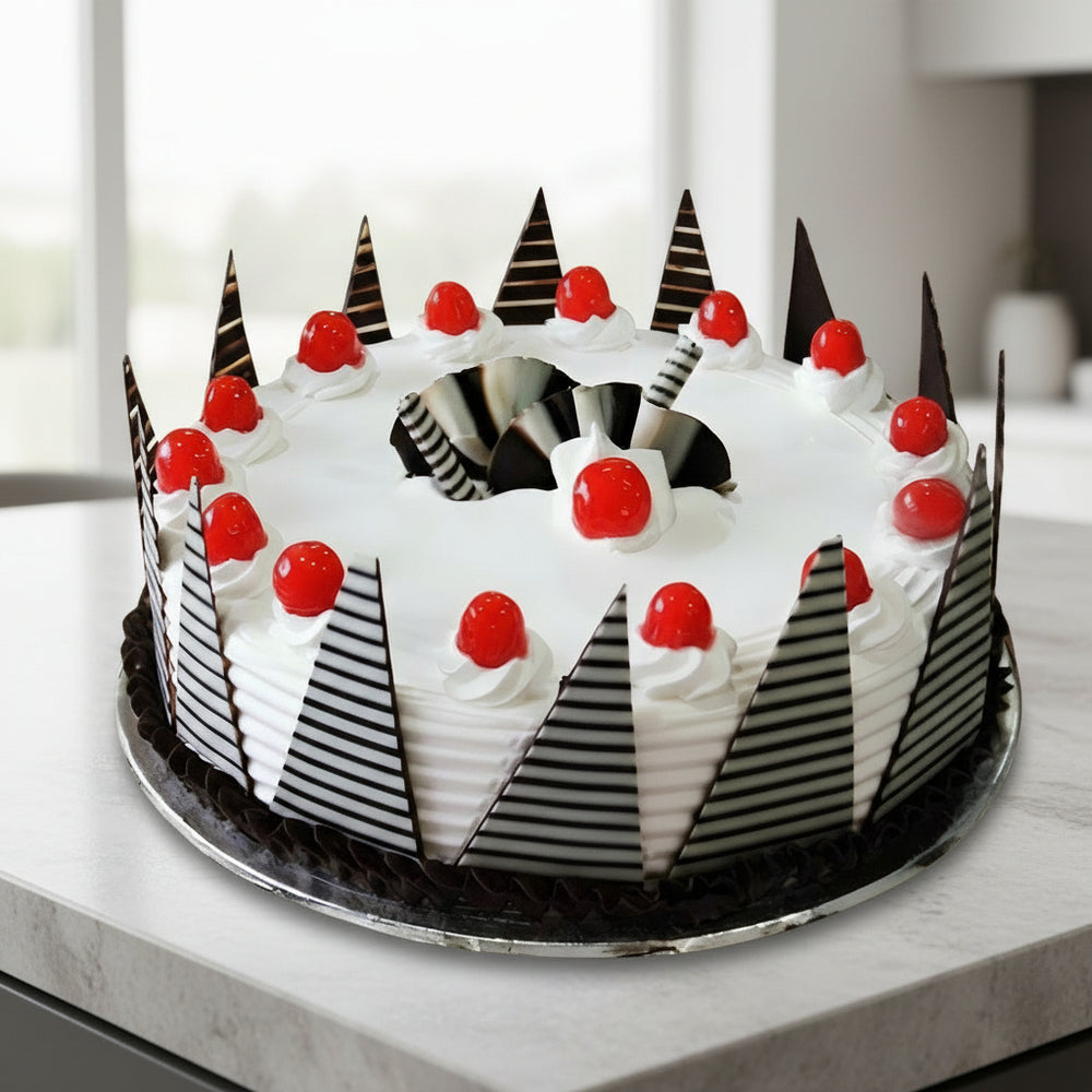 Fresh Cream Cherry Celebration Cake — white cream dollops, red cherries and striped pointed panels; India