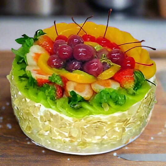 Black Forest Fruit Cake — mixed-fruit topping and pale textured sides; India