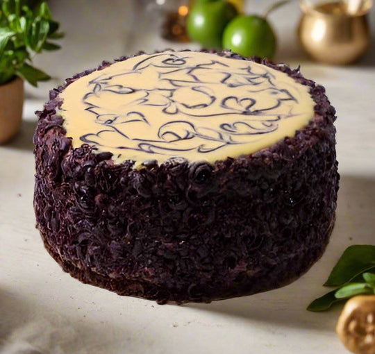 Caramel Chocolate Cake — pale caramel-coloured top and dark curly side texture; India