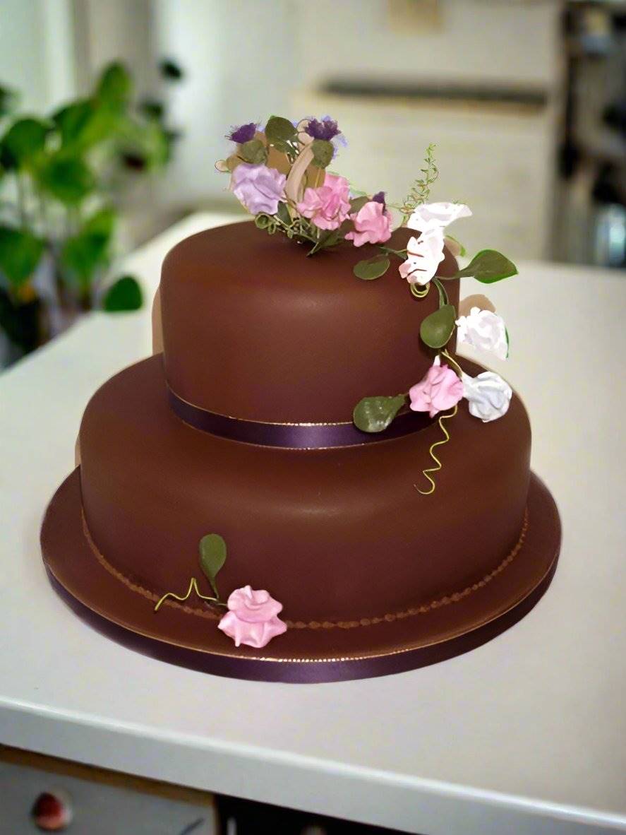 Brownie Step Cake — brown finish with pink flowers and delicate decorative lines; India