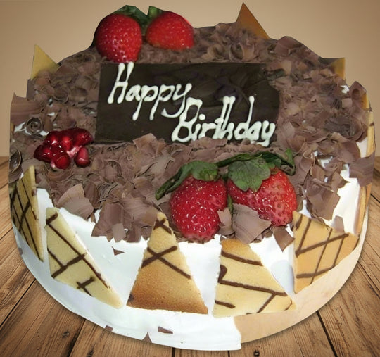 Black Forest Cake Topped with Cream & Berries — white and dark decorative panels with strawberry topping; India
