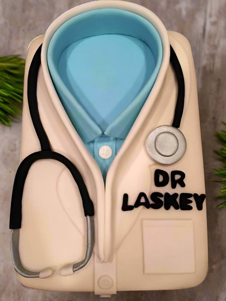 Doctor Coat Theme Cake — doctor-coat styling with a blue shirt panel and stethoscope; India