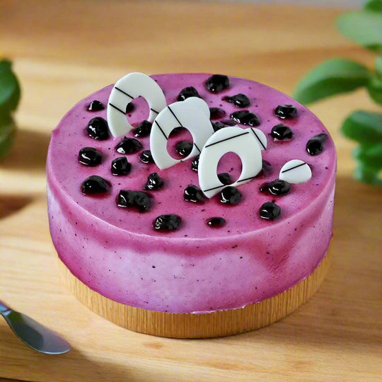 Blueberry Cake — purple finish, dark berries and pale curled pieces; India