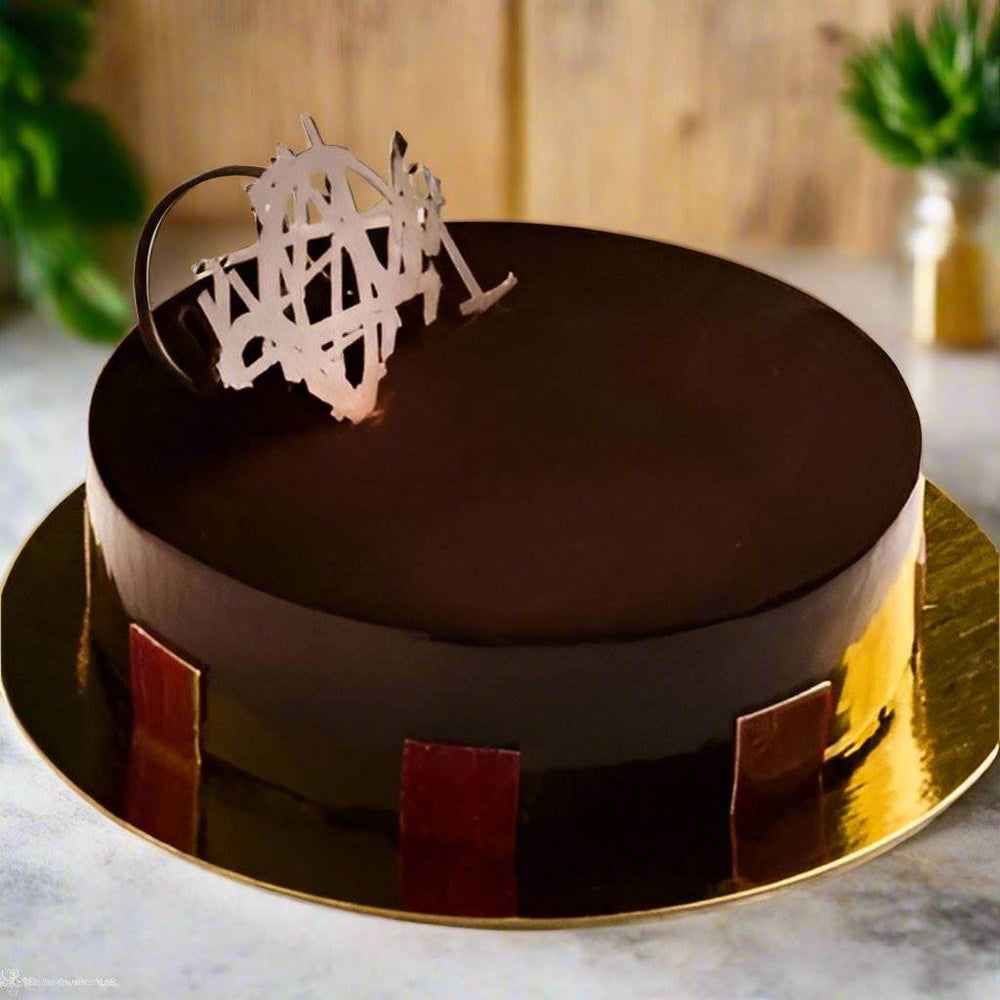 Celebration Chocolate Beauty Cake — smooth dark frosting and contrasting rectangular side panels; India