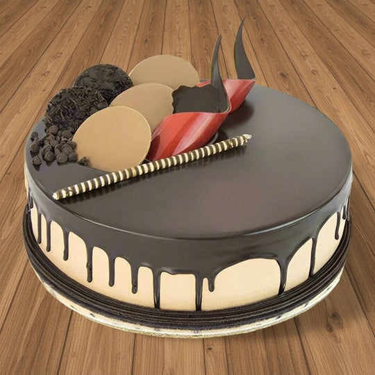 Chocolate Delight Yummy Cake — dark drip glaze and contrasting decorative pieces; India