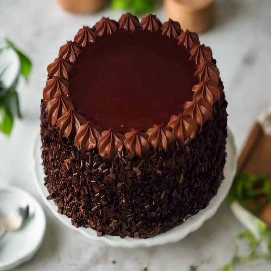 Chocolate Bliss Cake — glossy dark centre, pointed piping and chocolate-textured sides; India