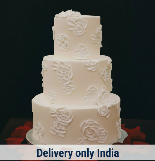 Classic Floral Elegance 3-Tier Step Cake — white finish with raised rose-style motifs; India