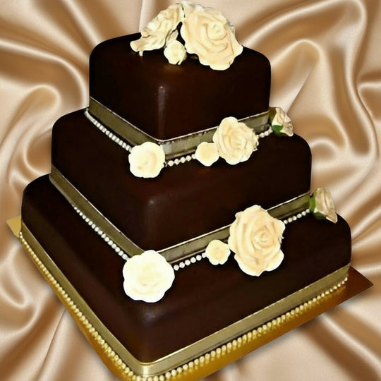3 Step Chocolate Cake — dark square tiers with pale floral bands; India