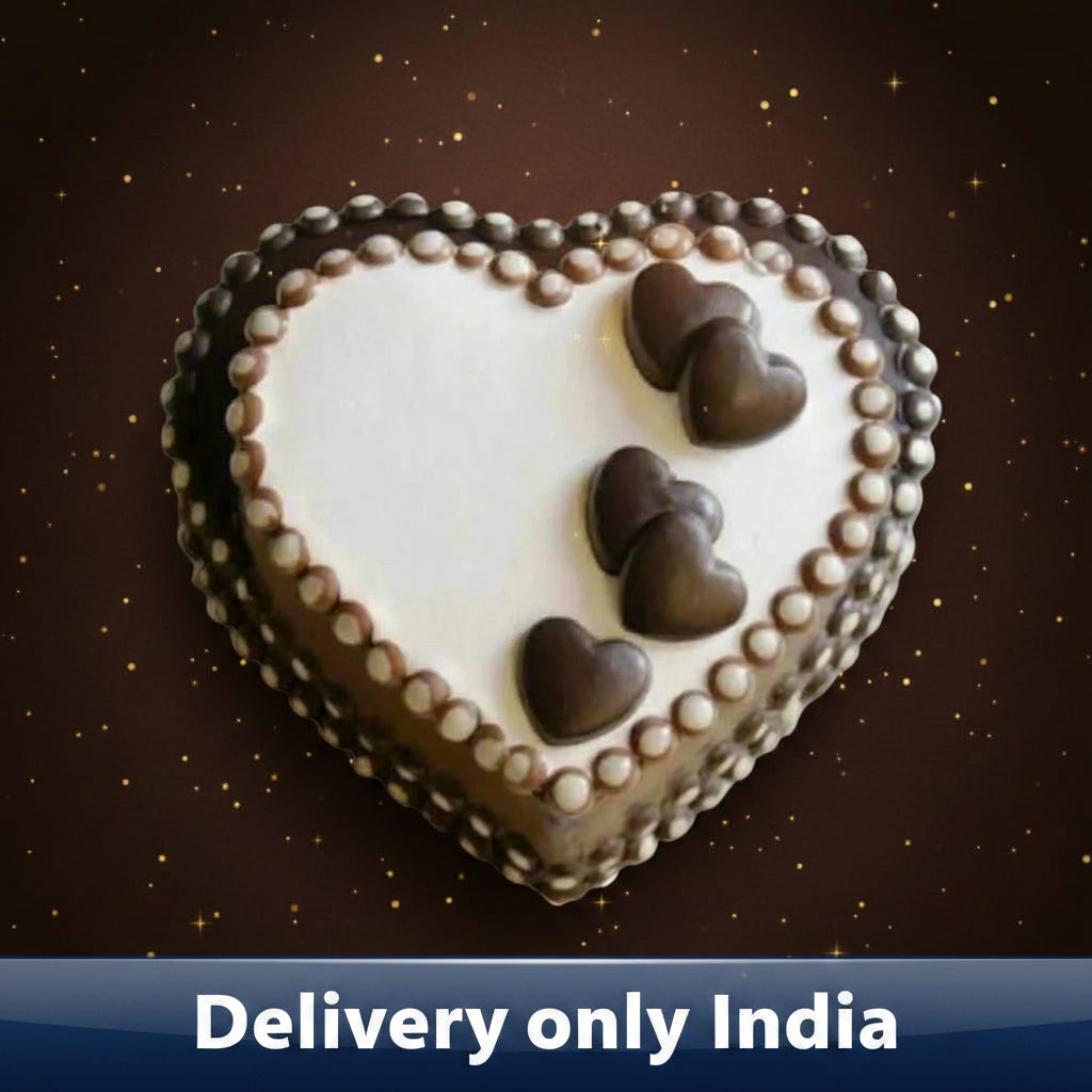 Heart-Shaped Chocolate Cake — white centre, dark border and heart-shaped accents; India