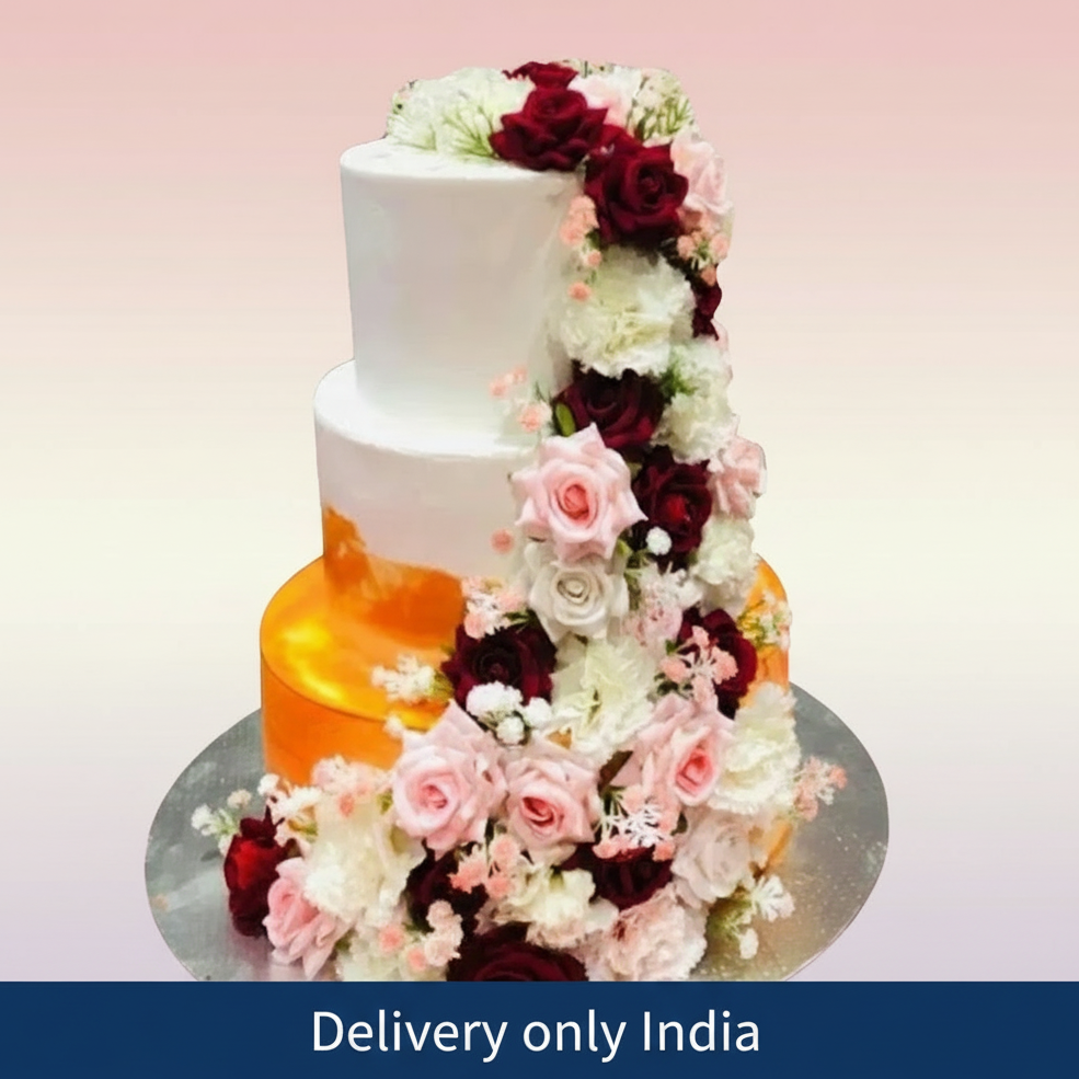 3-Step Beauty Cake — white-and-gold wedding tiers with cascading flowers; India