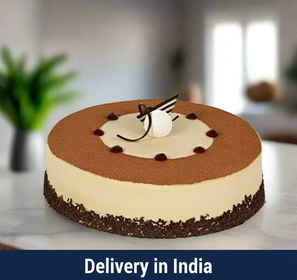 Tiramisu Cake - 1 kg — pale cheesecake-like layer, brown top and dark decorative drizzle; India