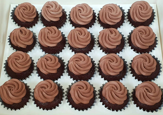 Chocolate Cupcakes - 36 Pieces — brown piped swirls across a large cupcake arrangement; India