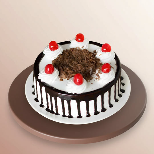 Yummy Black Forest Delight Cake — dark drip sides, white cream dollops and cherry accents; India