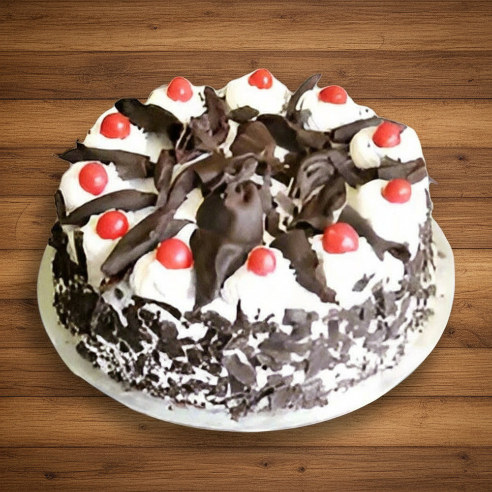 Shaving Decor Black Forest Delight Cake — white cream topping, dark shavings and red cherries; India