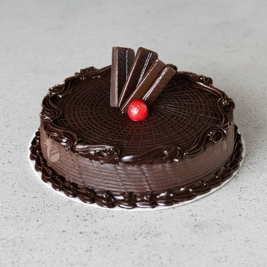 Chocolate Dessert Cake — dark concentric top pattern and striped decorative sticks; India