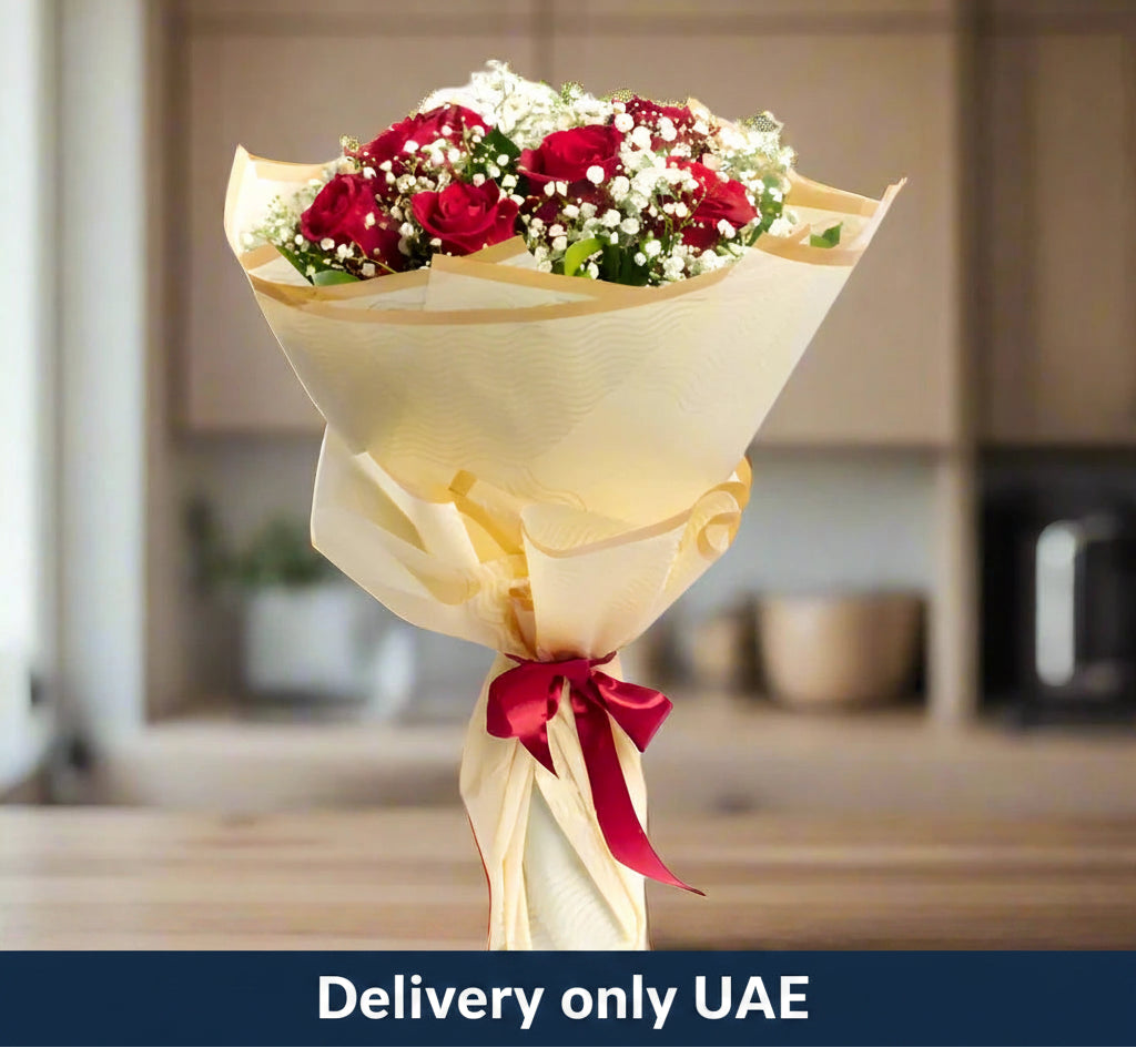 Elegant bouquet of exotic red roses with ribbon