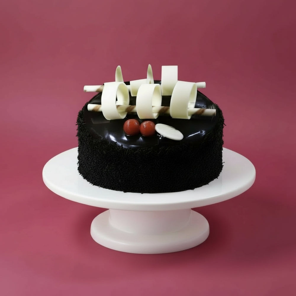 Chocolate Rice Cake — dark crumb finish and upright pale decorative pieces; India