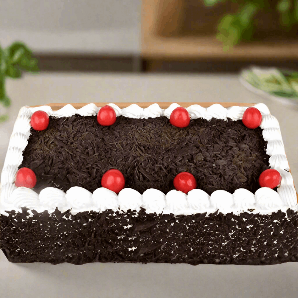 Black Forest 2 kgs Special Cake — dark crumb finish, cream border and red cherries; India
