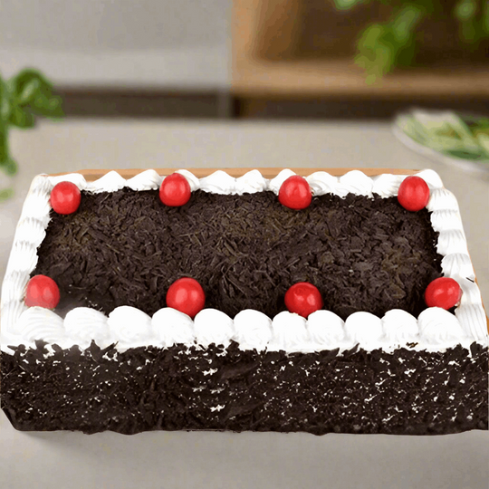 Black Forest 2 kgs Special Cake — dark crumb finish, cream border and red cherries; India