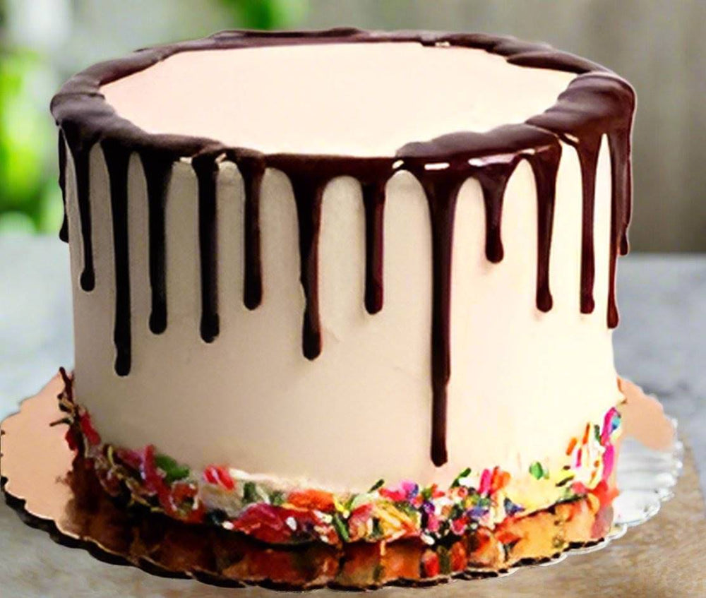 Drip Finish Creamy Chocolate Cake — tall pale finish, dark drip glaze and colourful lower border; India