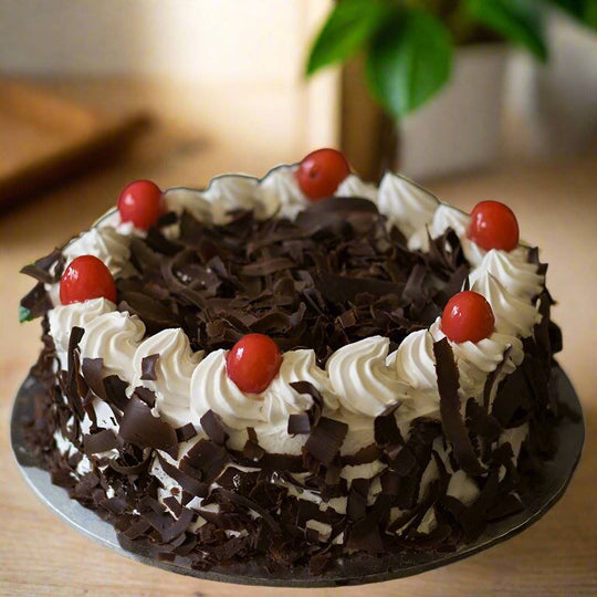 Black Forest Cake Simple — dark chocolate shavings and white cream swirls; India