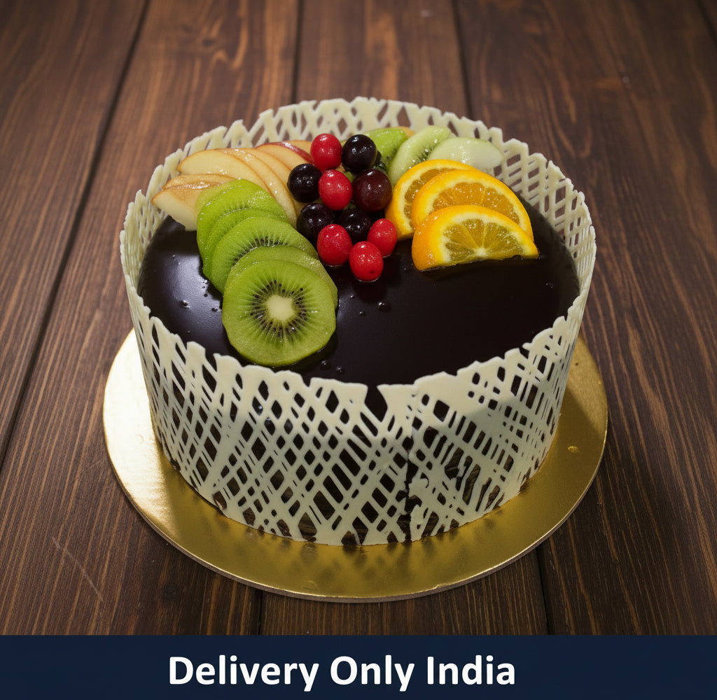 Fruit Topped Chocolate Fruit Cake — dark smooth top with a mixed-fruit cluster and pale openwork sides; India