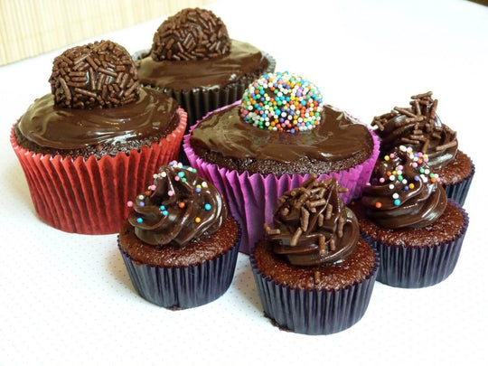 Brownie Cupcakes — assorted dark frosting and colourful sprinkle toppings; India