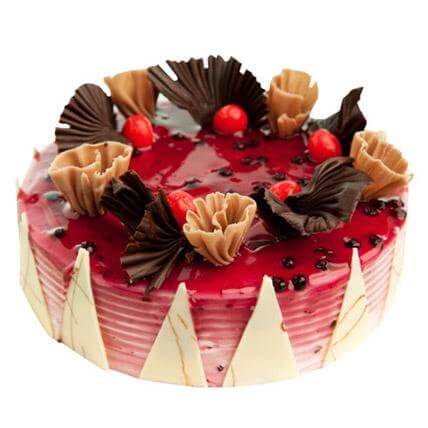 Blueberry Decorative Cake — pink glaze, pale triangular side panels and curled topping; India