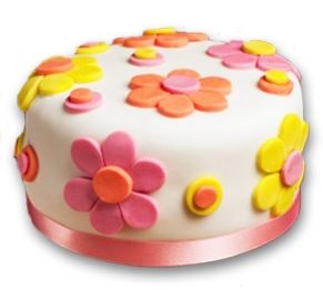 Flower Designer Cake — white finish, colourful flower motifs and a pink ribbon; India