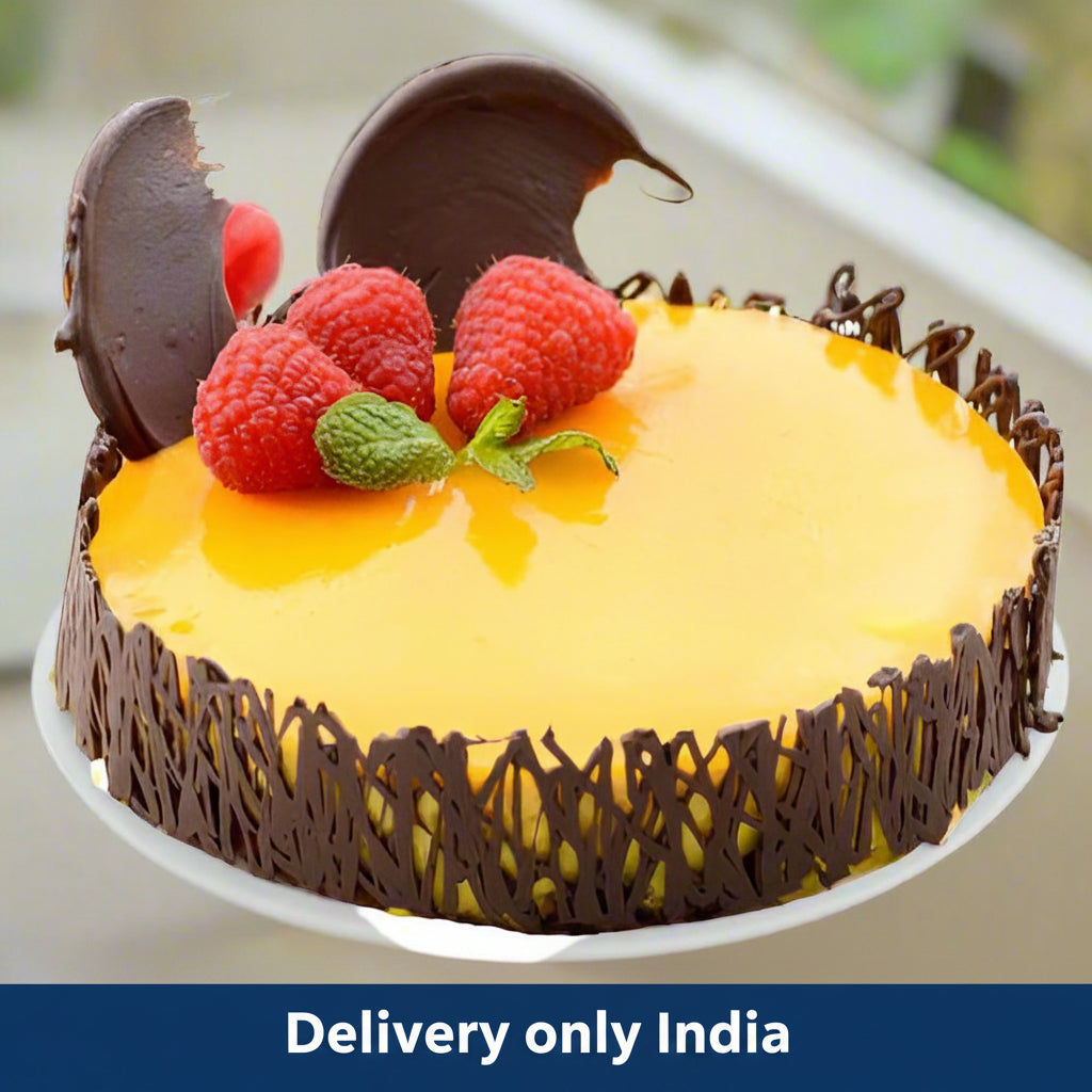 Yummy Mango Cake — yellow glazed finish, strawberry topping and dark openwork sides; India