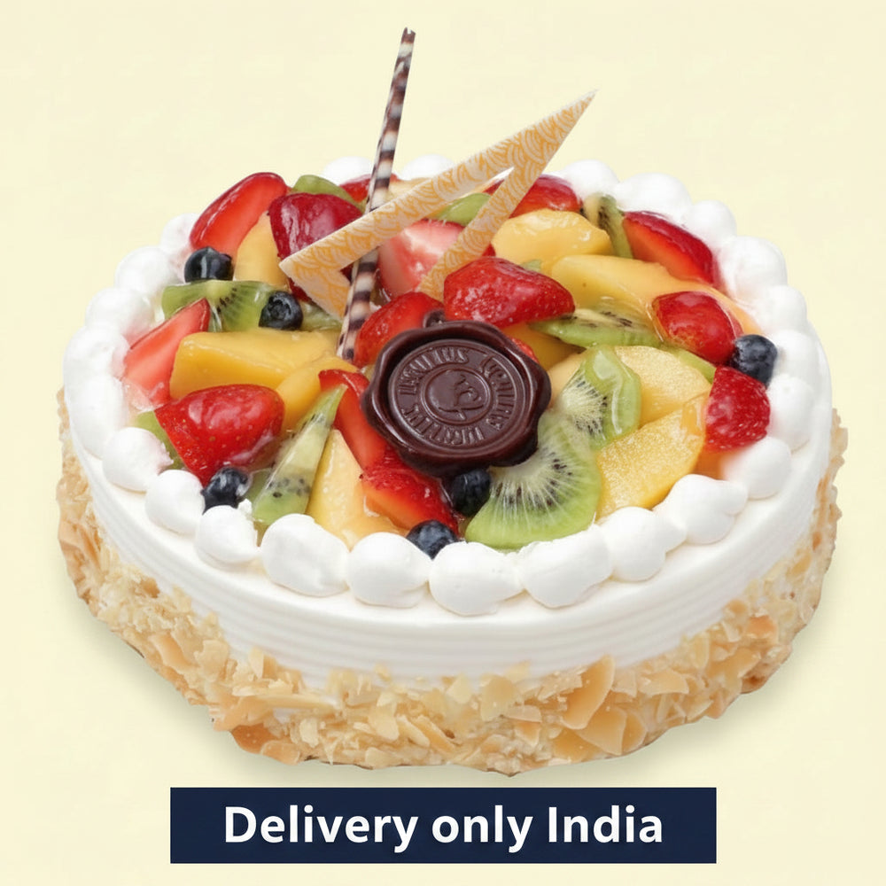 Fruit & Walnut Cake — white cream border and a mixed-fruit centre; India