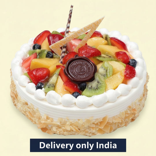 Fruit & Walnut Cake — white cream border and a mixed-fruit centre; India