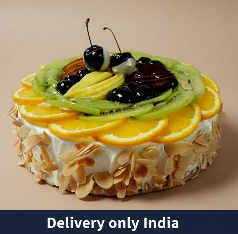 Special Fresh Fruit Cake — nut-covered sides and an overlapping fruit-slice topping; India