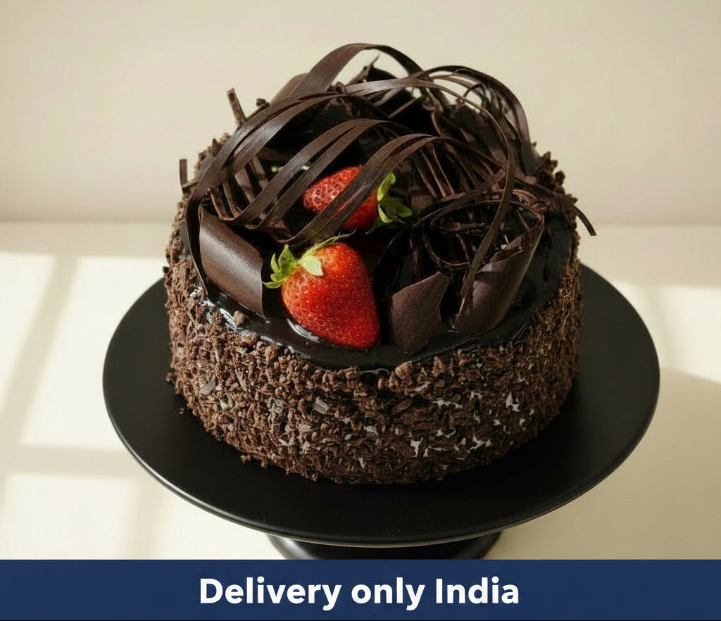 Black Chocolate Cake — dark textured sides, curled topping and a strawberry accent; India