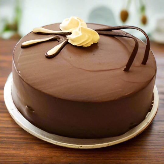 Tempting Chocolate Cake — smooth brown finish and a pale cream swirl; India