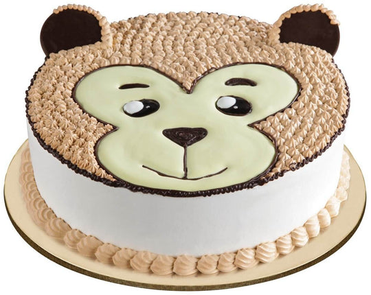 Monkey Face Cake — brown monkey-face piping and a white side finish; India