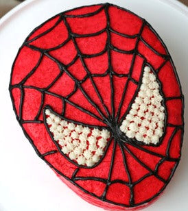 Spiderman Cake — a red Spider-Man mask design with dark web lines; India