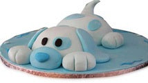 Blue Dog Cake — a pale blue dog figure with a rounded nose; India