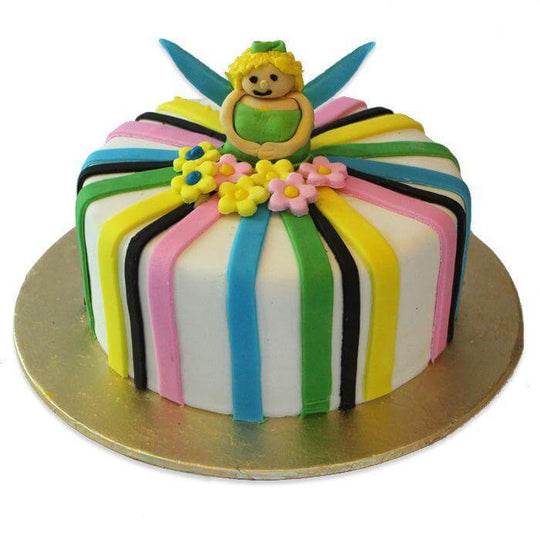 Fondant Theme Cake — colourful ribbon-style bands, a bow and a small figure topper; India