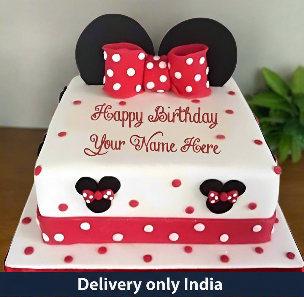 Minnie Mouse Birthday Cake — white-and-red Minnie Mouse styling with a spotted bow; India