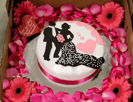 Baby Shower Cake — a printed baby-shower silhouette with pink decoration; India