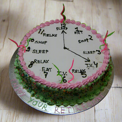 Time to Retire Theme Cake — a clock-face retirement layout with pink edging; India