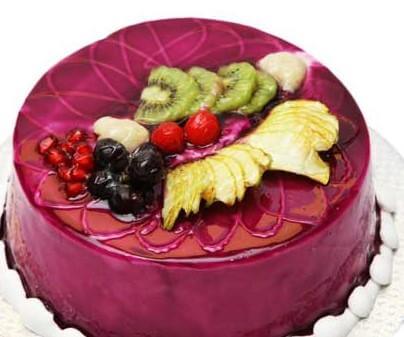 Melano Jelly Cake — purple glaze and a colourful mixed-fruit topping; India
