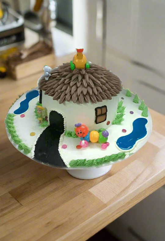 Farm House Cake — thatched-hut design with farmyard-themed figures; India