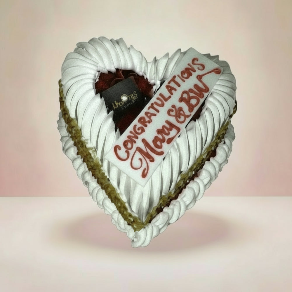 Vanilla Heart-Shaped Cake — white cream piping and a celebratory greeting; India