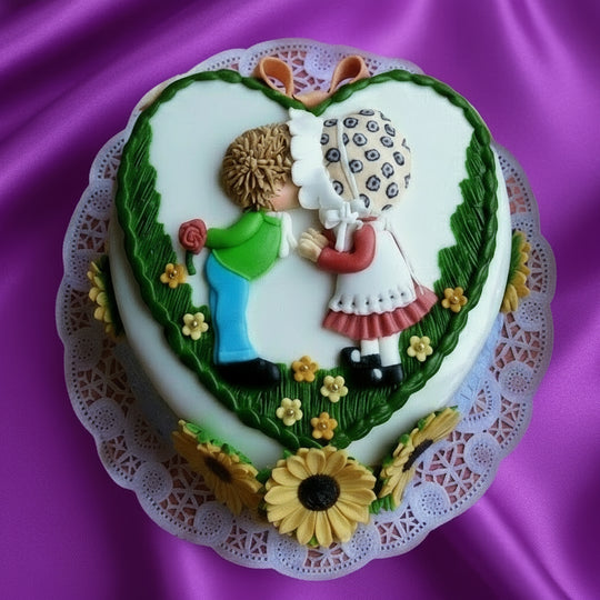 Celebration Love Cake — a green border and couple-themed figures; India