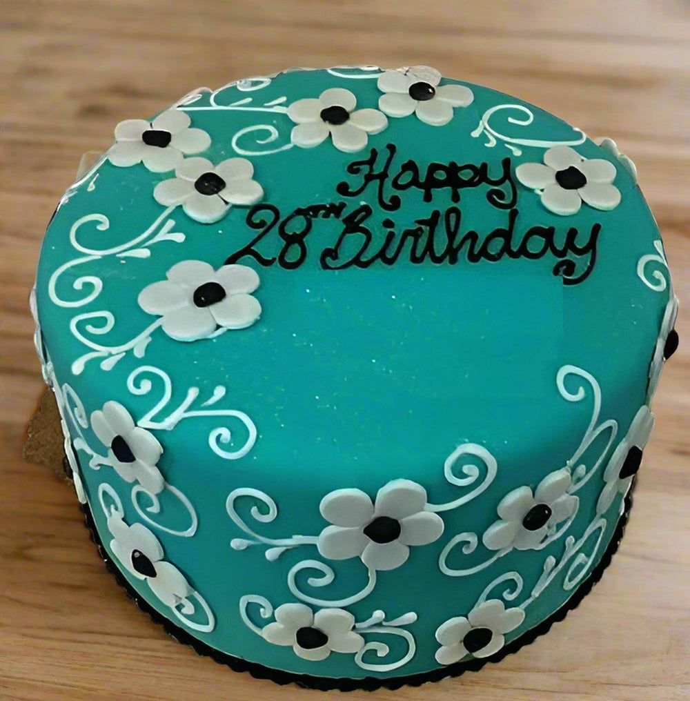 28th Birthday Gifts Cake — turquoise finish, white flowers and curling piped patterns; India