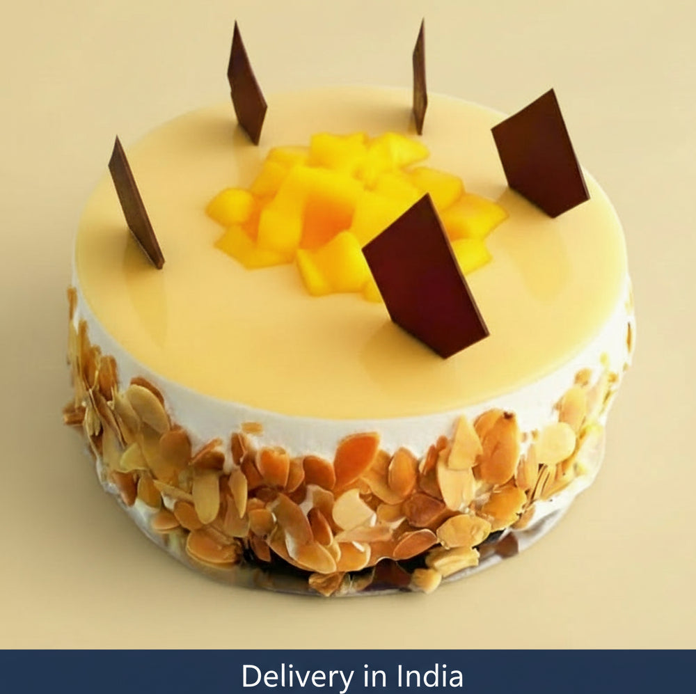 Fruit Topped Fresh Fruit Cake — pale finish, nut-like side flakes and yellow fruit pieces; India