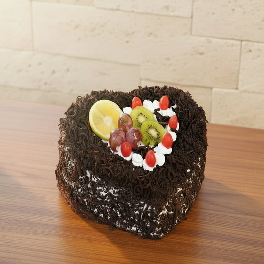 Black Forest Heart Cake — dark chocolate-textured finish and a central fruit decoration; India